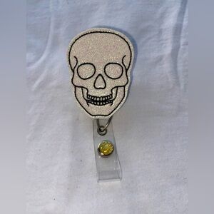Skull ID retractable badge reel